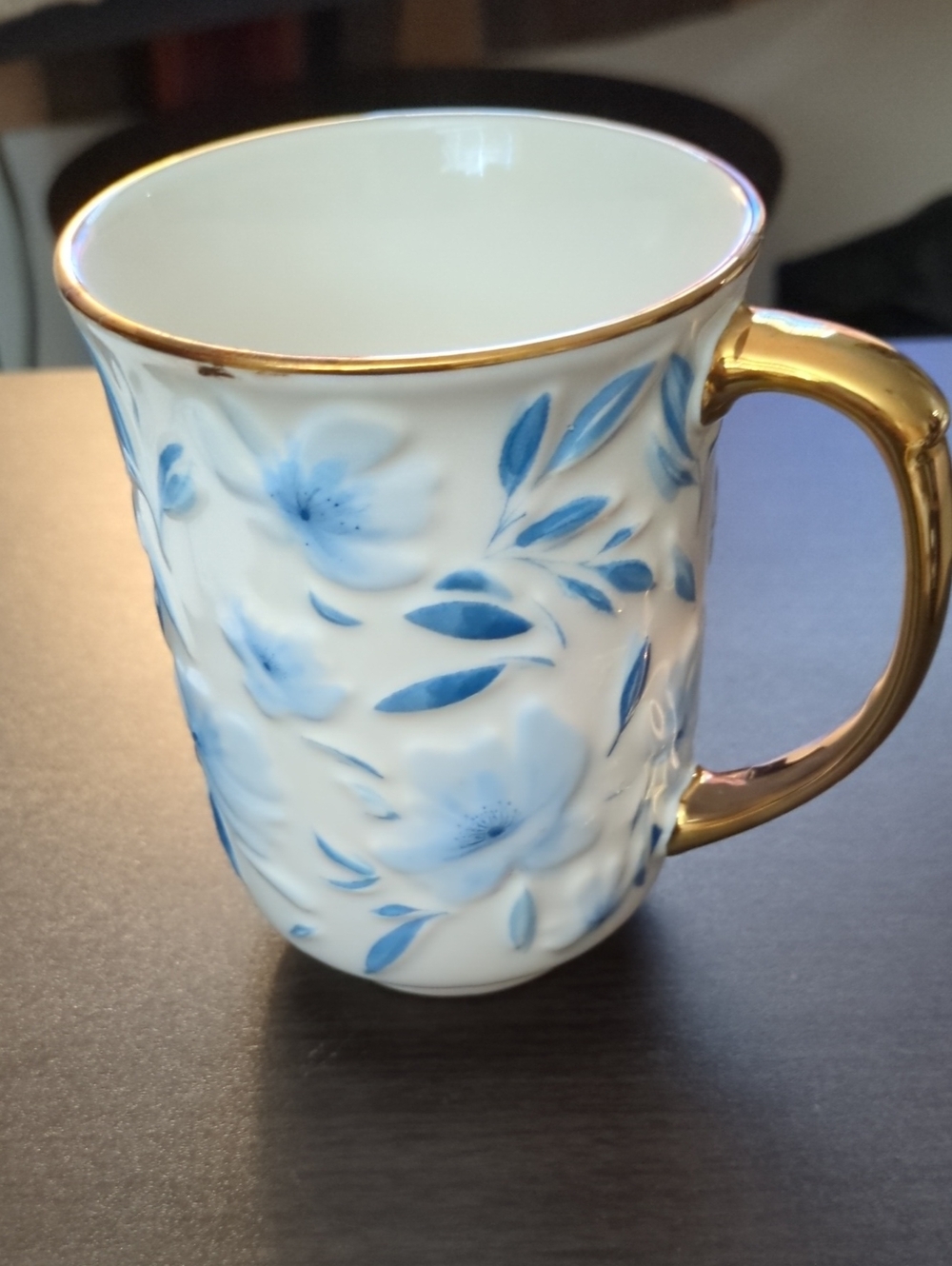 Papyrus White Porcelain Mug with Blue Floral Pattern and Gold Handle